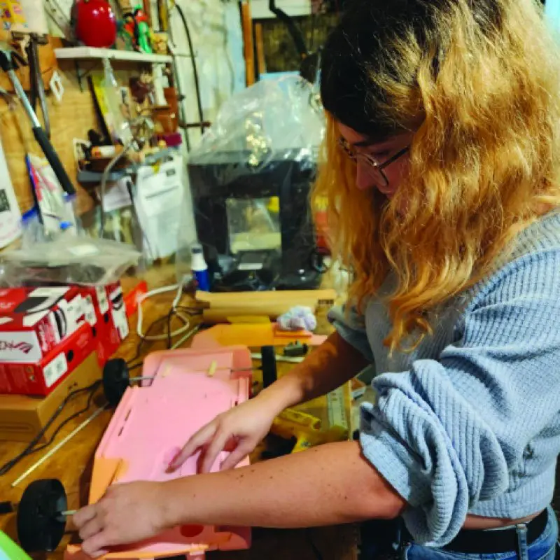 Person building a large model car