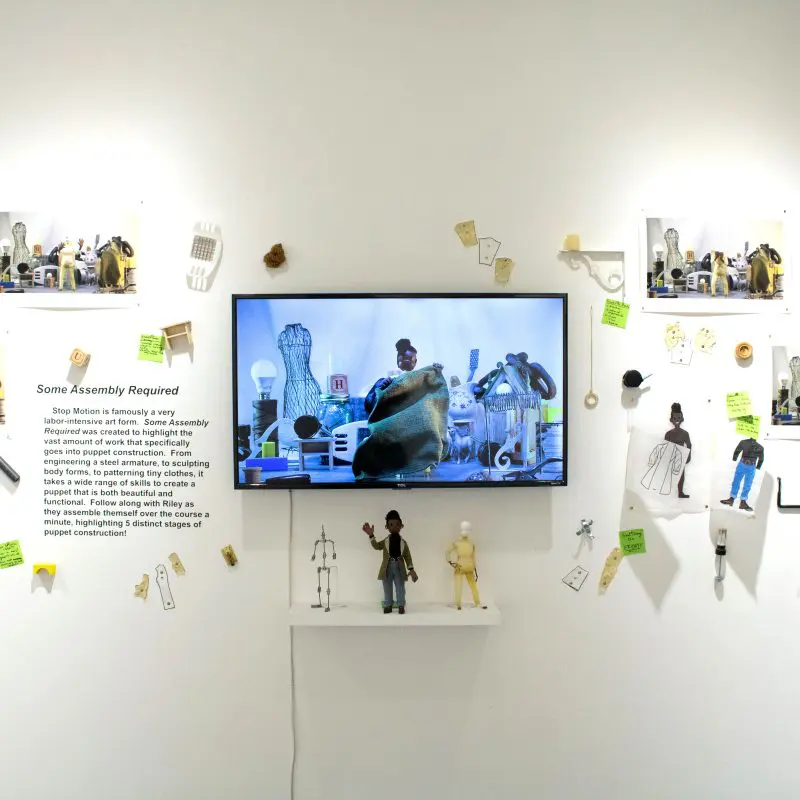 A photo of a stop motion exhibit titled "Some Assembly Required"