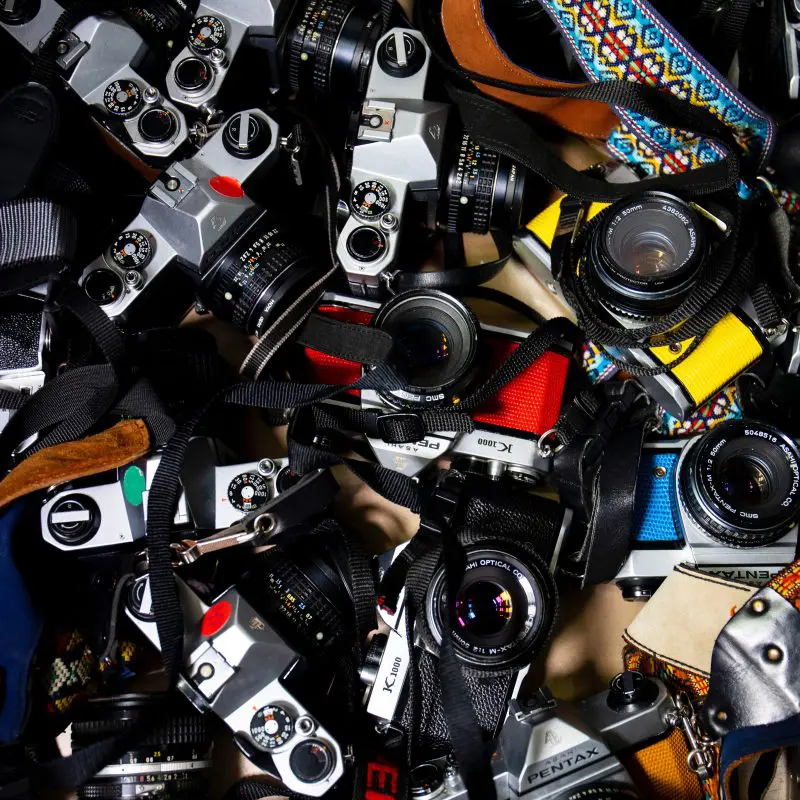 A pile of cameras