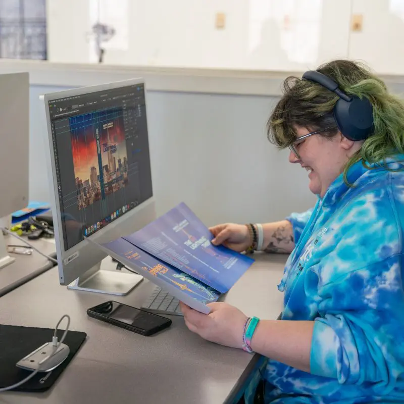 Person looking at book cover