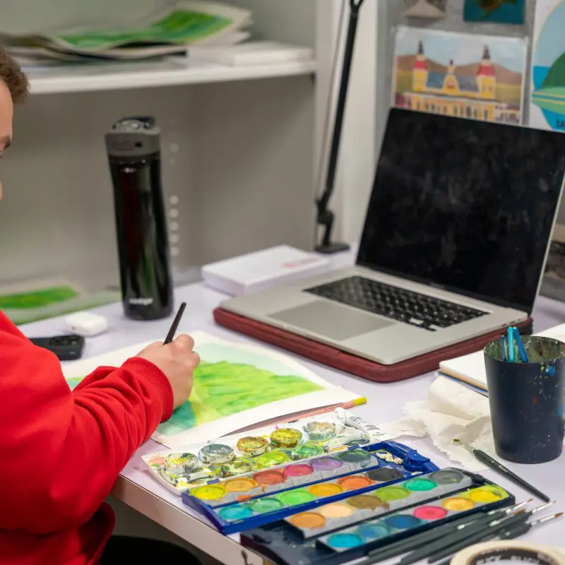 Person painting with watercolor