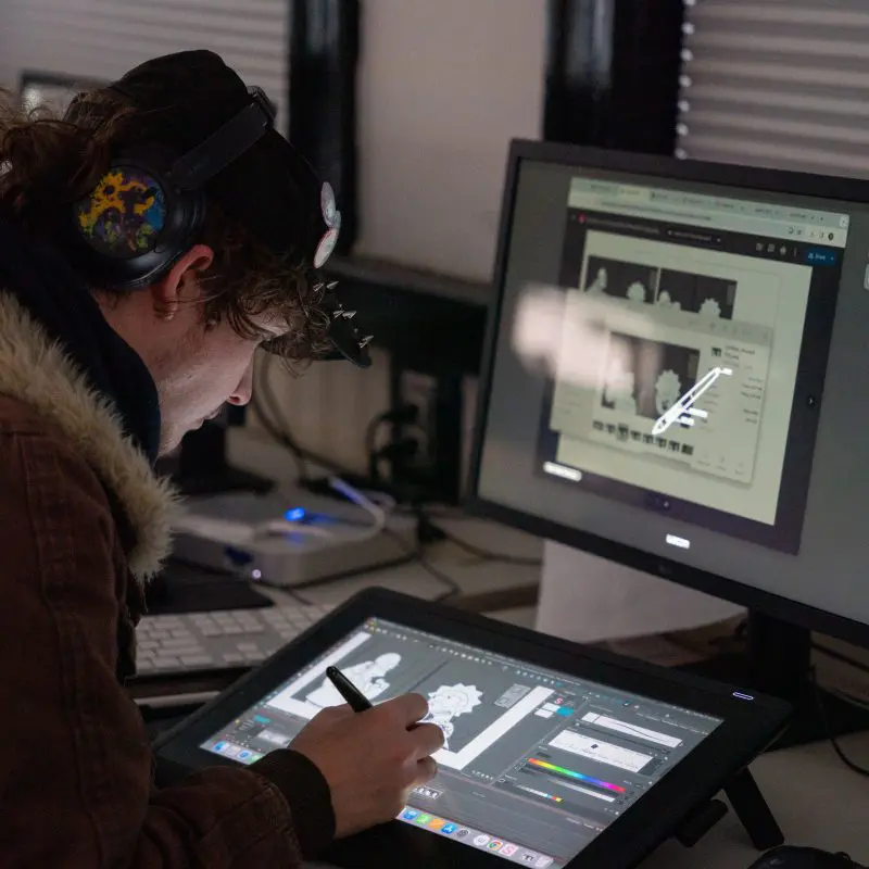 Person drawing on tablet