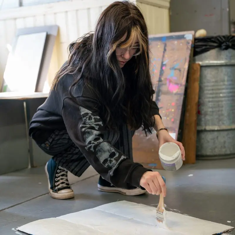 Person painting on the floor