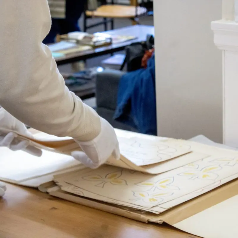 Person stacking paper