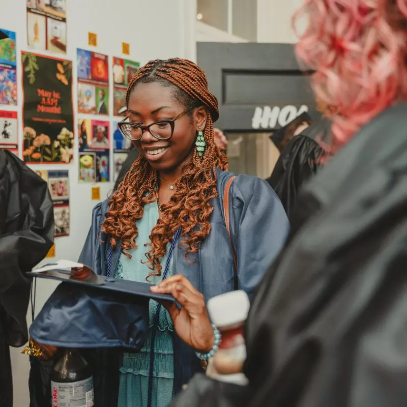Student holding graduation cap