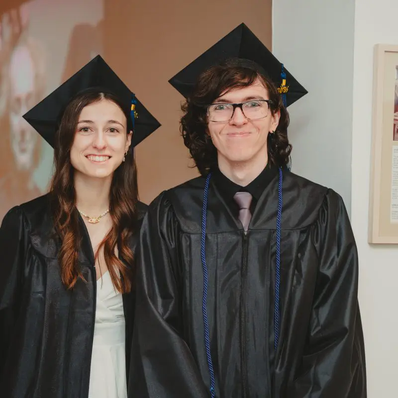 Students wearing graduation caps and gowns