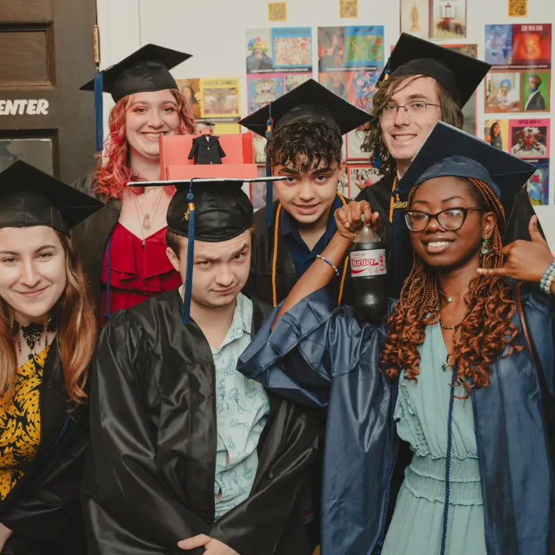 Group of students with graduation caps and gowns