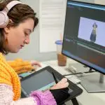 student working at a computer doing animation